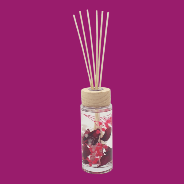 Velvet Rose and Our reed diffuser on a purple background